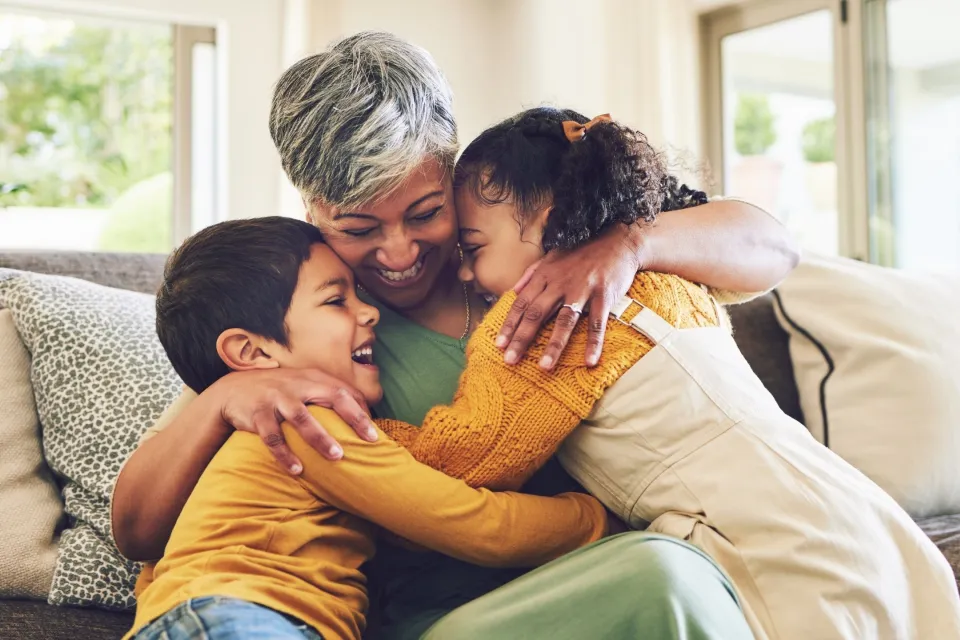 Grandma cuddles grandchildren - healthy patients of The Doctors